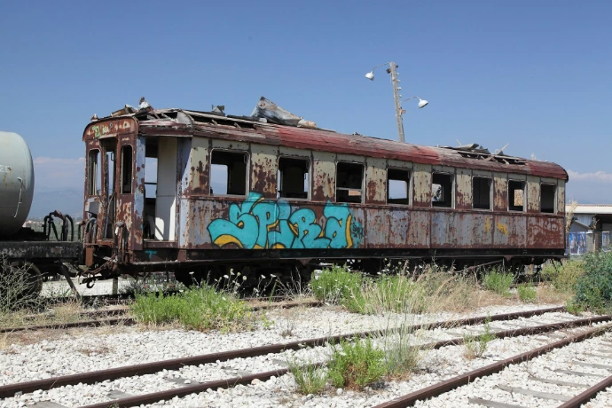 an old abandoned train car with graffiti on it